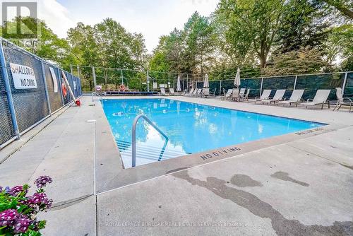 809 - 1201 North Shore Boulevard E, Burlington, ON - Outdoor With In Ground Pool