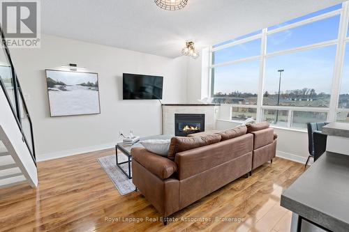 433 - 200 Manitoba Street, Toronto, ON - Indoor Photo Showing Living Room With Fireplace