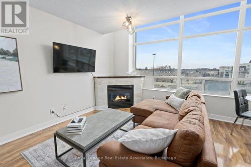 433 - 200 Manitoba Street, Toronto, ON - Indoor Photo Showing Living Room With Fireplace