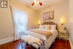 Primary upstairs bedroom and more hardwood floors - 
