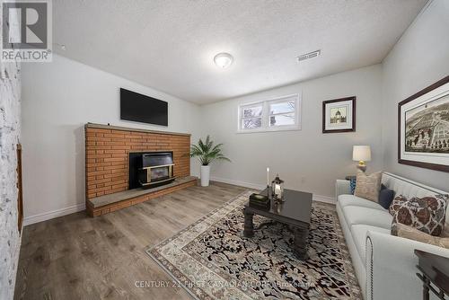 virtually staged - 6 Spartan Drive, Brantford, ON - Indoor Photo Showing Living Room With Fireplace