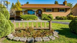 Brick bungalow on large landscaped lot - 