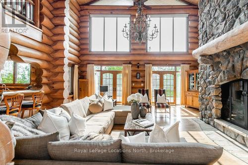 100 Melissa Lane, Tiny, ON - Indoor Photo Showing Living Room With Fireplace