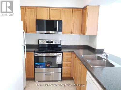 1802 - 4879 Kimbermount Avenue, Mississauga, ON - Indoor Photo Showing Kitchen With Double Sink