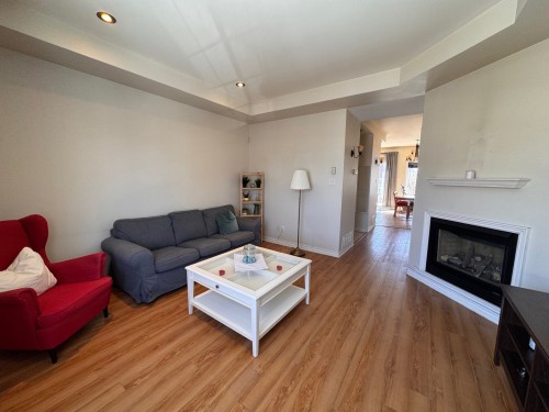 Living Room - 7844 Rue Lemelin, Brossard, QC - Indoor Photo Showing Living Room With Fireplace