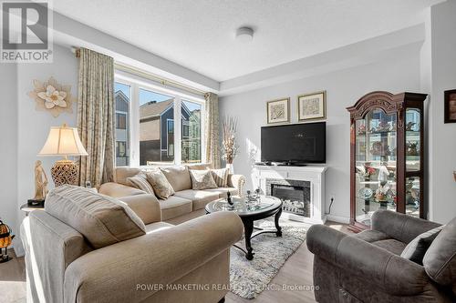 715 Hydrus Private, Ottawa, ON - Indoor Photo Showing Living Room With Fireplace