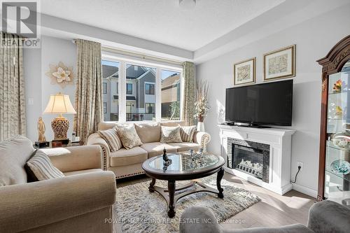 715 Hydrus Private, Ottawa, ON - Indoor Photo Showing Living Room With Fireplace