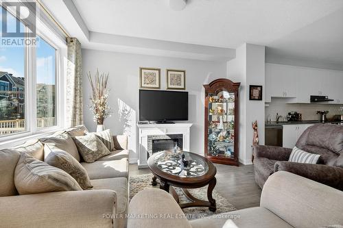 715 Hydrus Private, Ottawa, ON - Indoor Photo Showing Living Room With Fireplace