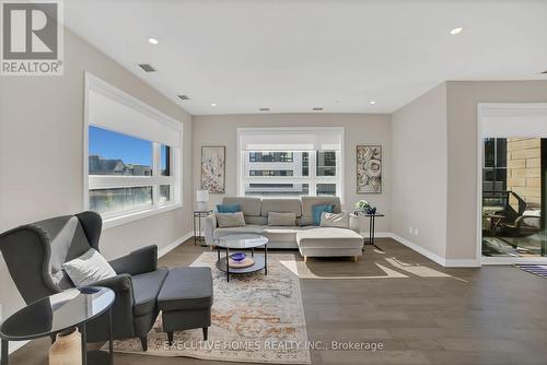 208 - 3265 Carding Mill Trail, Oakville, ON - Indoor Photo Showing Living Room