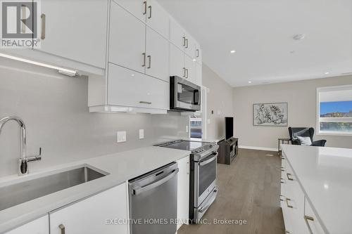 208 - 3265 Carding Mill Trail, Oakville, ON - Indoor Photo Showing Kitchen With Stainless Steel Kitchen With Upgraded Kitchen