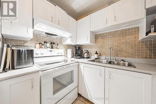 313 - 1451 Walkers Line, Burlington, ON - Indoor Photo Showing Kitchen With Double Sink