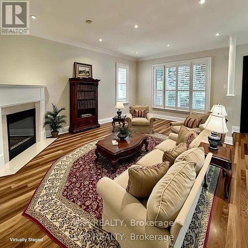 Virtually Staged Living Room - 27 Butterwood Lane, Whitchurch-Stouffville (Stouffville), ON - Indoor Photo Showing Living Room With Fireplace