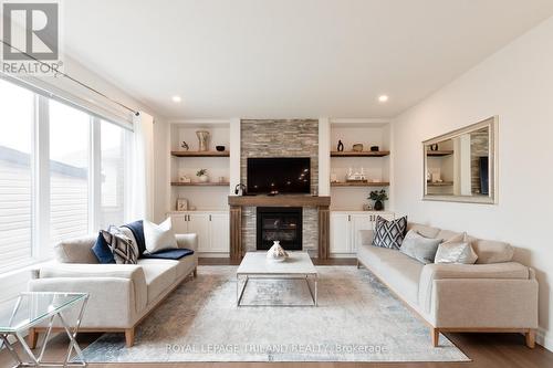 Family Room w/ Gas Fireplace and Built-in shelving - 6447 Storey Chase, London South (South V), ON - Indoor Photo Showing Living Room With Fireplace