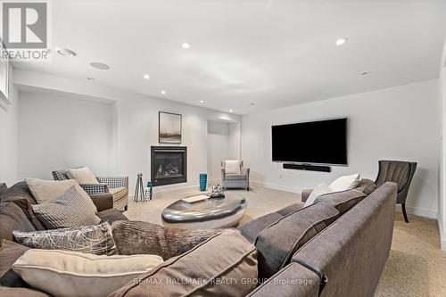 Recreation room - 91 Shaughnessy Crescent, Ottawa, ON - Indoor Photo Showing Living Room With Fireplace