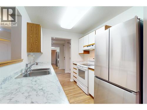 780 Houghton Road Unit# 201, Kelowna, BC - Indoor Photo Showing Kitchen With Double Sink