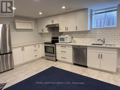27 Wetherburn Drive, Whitby (Williamsburg), ON - Indoor Photo Showing Kitchen With Double Sink