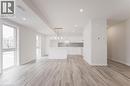 Open concept living space featuring light-toned flooring, recessed lighting, and large windows providing natural light - 686 Benninger Drive, Kitchener, ON  - Indoor 