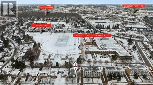 Aerial view highlighting the property's proximity to a park, tennis courts, and a secondary school - 24 Austin Drive, Waterloo, ON - Outdoor With View