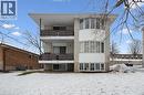 The property features a multi-story building with light-colored brick and white siding accents - 24 Austin Drive, Waterloo, ON  - Outdoor 