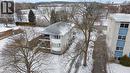 The property features a multi-story building with a grey shingle roof and a prominent bay window design on one facade - 24 Austin Drive, Waterloo, ON  - Outdoor 