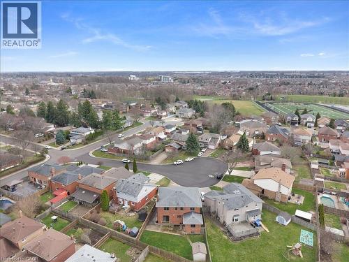 Expansive aerial view showcasing the surrounding residential area and nearby recreational fields - 18 Marcel Place, Hamilton, ON - Outdoor With View