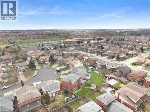 Aerial view of the neighborhood showcasing a cul-de-sac and residential properties with green spaces - 18 Marcel Place, Hamilton, ON - Outdoor With View