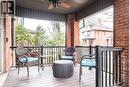 Inviting covered porch with a ceiling fan, brick columns, and a railing - 36 Eastbourne Avenue, Hamilton, ON  - Outdoor With Deck Patio Veranda With Exterior 
