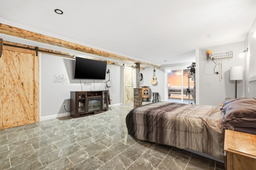 Chambre à coucher principale - 957 Rue Dufferin, Granby, QC - Indoor Photo Showing Other Room With Fireplace