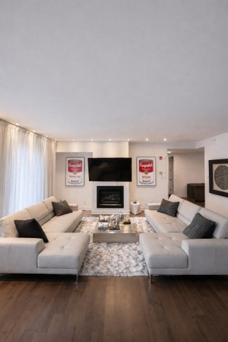 Living Room - Ph02-2160 Av. Terry-Fox, Laval (Chomedey), QC - Indoor Photo Showing Living Room With Fireplace