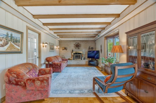 Family Room - 187 Av. Centennial, Beaconsfield, QC - Indoor Photo Showing Living Room With Fireplace