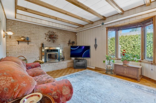 Family Room - 187 Av. Centennial, Beaconsfield, QC - Indoor Photo Showing Other Room With Fireplace
