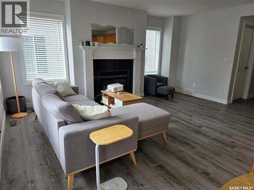 36 103 Banyan Crescent, Saskatoon, SK - Indoor Photo Showing Living Room With Fireplace
