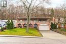 Mediterranean / spanish-style home with a front lawn, concrete driveway, a balcony, a chimney, and an attached garage - 24 Hildegard Drive, Hamilton, ON  - Outdoor 