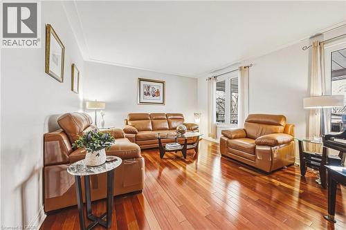 Living area with wood-type flooring and crown molding - 24 Hildegard Drive, Hamilton, ON - Indoor Photo Showing Living Room