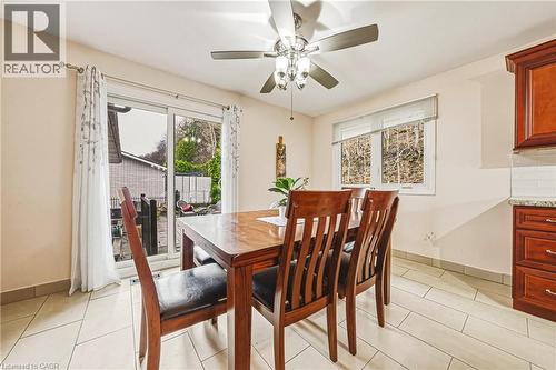 Dining room featuring a ceiling fan and light tile patterned flooring - 24 Hildegard Drive, Hamilton, ON - Indoor Photo Showing Dining Room