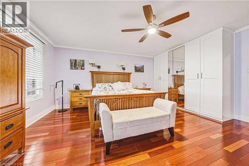 Bedroom featuring light wood-style floors, ceiling fan, and crown molding - 24 Hildegard Drive, Hamilton, ON - Indoor Photo Showing Bedroom