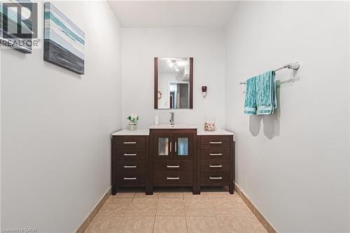 Bathroom featuring vanity and light tile patterned flooring - 24 Hildegard Drive, Hamilton, ON - Indoor