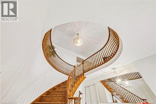 Stairs with a chandelier - 24 Hildegard Drive, Hamilton, ON - Indoor Photo Showing Other Room