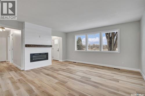 1017 Mcmillan Avenue, Saskatoon, SK - Indoor Photo Showing Living Room With Fireplace
