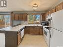 231 Elliott Place, Swift Current, SK  - Indoor Photo Showing Kitchen With Double Sink 