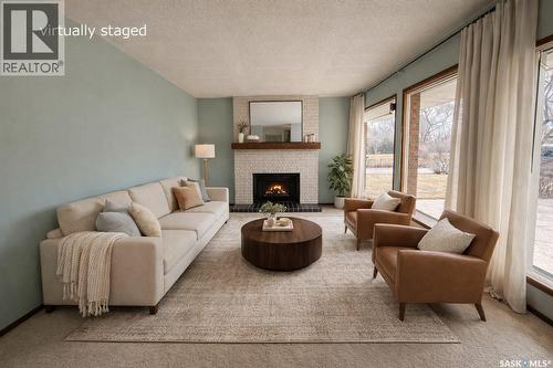 231 Elliott Place, Swift Current, SK - Indoor Photo Showing Living Room With Fireplace