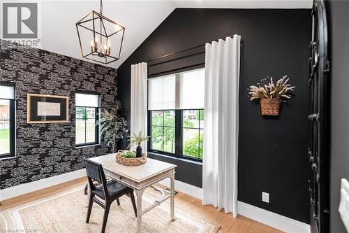 Vaulted ceiling with a geometric pendant light fixture - 253 Central Avenue, Grimsby, ON 