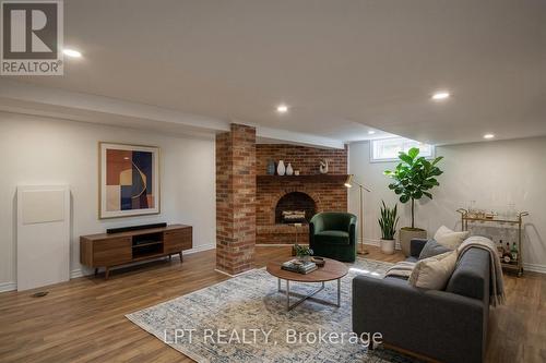 Virtually Staged - 2317 Elmira Drive, Ottawa, ON - Indoor Photo Showing Living Room With Fireplace