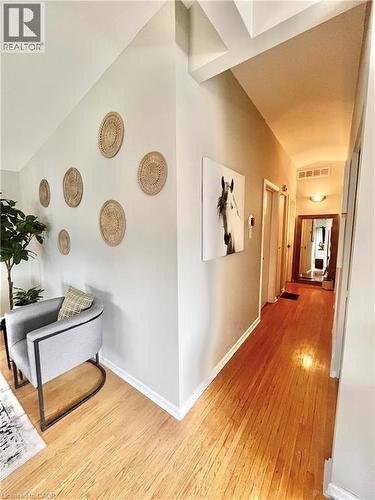 The property features hardwood floors and a well-lit hallway - 241 Thorner Drive, Hamilton, ON - Indoor Photo Showing Other Room