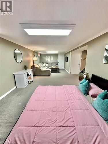 The interior space features light gray walls, carpeted flooring, and recessed lighting - 241 Thorner Drive, Hamilton, ON - Indoor Photo Showing Bedroom