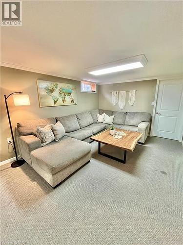 Living area featuring light-colored carpeting, recessed lighting, and a window - 241 Thorner Drive, Hamilton, ON - Indoor