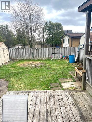 The property features a wood deck overlooking a lawn area with a wooden fence - 241 Thorner Drive, Hamilton, ON - Outdoor With Deck Patio Veranda