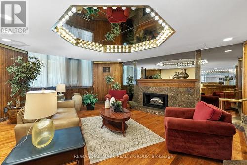 411 - 2871 Richmond Road, Ottawa, ON - Indoor Photo Showing Living Room With Fireplace