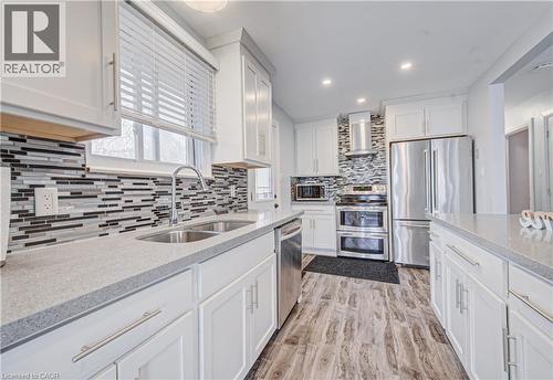 141 Mooregate Crescent, Kitchener, ON - Indoor Photo Showing Kitchen With Stainless Steel Kitchen With Double Sink With Upgraded Kitchen