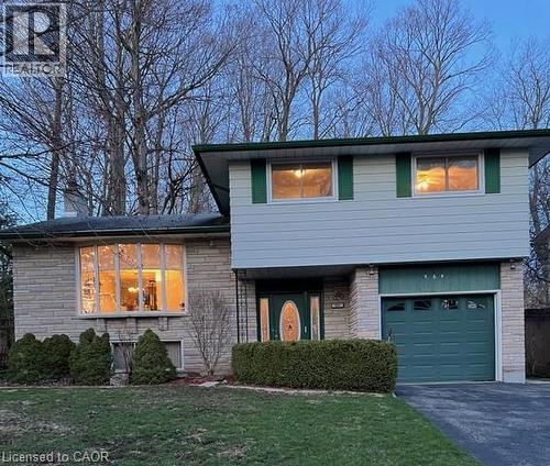 multi level home featuring asphalt driveway, a garage, and a front yard - 564 Glen Manor Boulevard, Waterloo, ON - Outdoor
